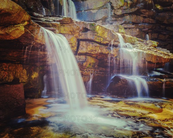 Vintage retro effect filtered hipster style image of tropical waterfall. Popokvil Waterfall, Bokor National Park, Cambodia, Asia