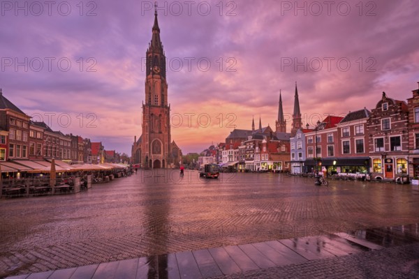 Delft, Netherlands, May 12, 2017: Nieuwe Kerk New Church protestant church on Delft Market Square Markt with dramatic sky on sunset. Delft, Netherlands