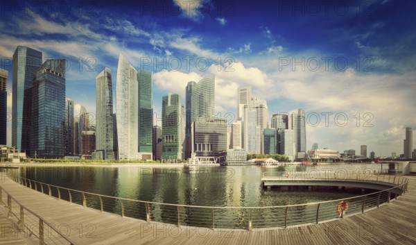 Travel Singapore, vintage retro effect filtered hipster style image of Singapore skyline of business district and Marina Bay panorama. Ultra wide angle