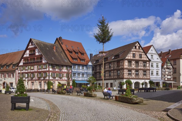 Market square with maypole, benches, flower tubs and half-timbered houses in Gengenbach, Black Forest, Ortenaukreis, Baden-Württemberg, Germany, Europe