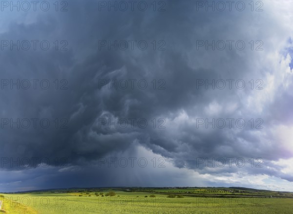 Thunderstorm cell with rainbow over fields near Krebs in the Osterzgebirge, Krebs, Saxony, Germany, Europe