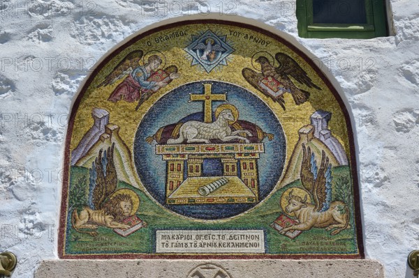 A religious mosaic with Christian symbols and angels, decorating a stone wall in a Catholic church, evangelist symbols, lion, bull, eagle, lamb, Monastery tis Apokalipsis, Patmos, Dodecanese, Greek Islands, Greece, Europe