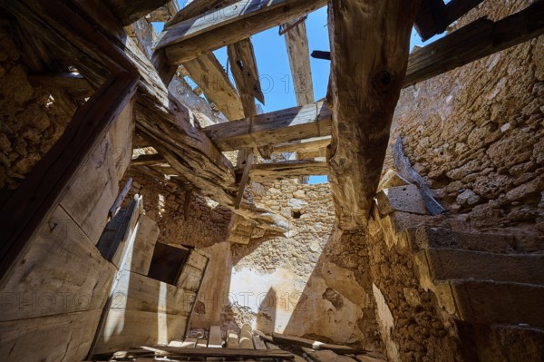 The interior of a crumbling mill with damaged wooden beams and a view of the blue sky, windmill, ruin, near Lindos, Lindos, Rhodes, Dodecanese, Greek Islands, Greece, Europe