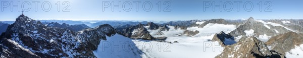 Panorama at the summit of the Wilder Freiger with summit cross and with glacier Übeltalferner and Wilder Freiger Ferner, picturesque mountain landscape, aerial view, Stubai Alps, South Tyrol, Italy, Europe