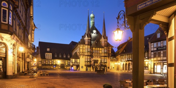 Market square with atmospherically illuminated town hall in the evening, Wernigerode, Harz, Saxony-Anhalt, Germany, Europe