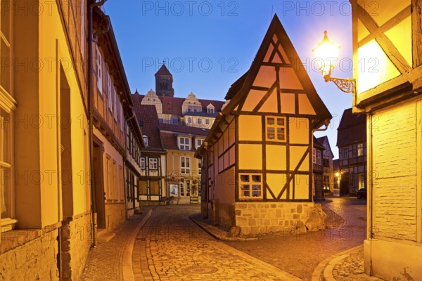Half-timbered houses in Finkenherd with Schlossberg, alley in the old town centre of the World Heritage town of Quedlinburg, Saxony-Anhalt, Germany, Europe