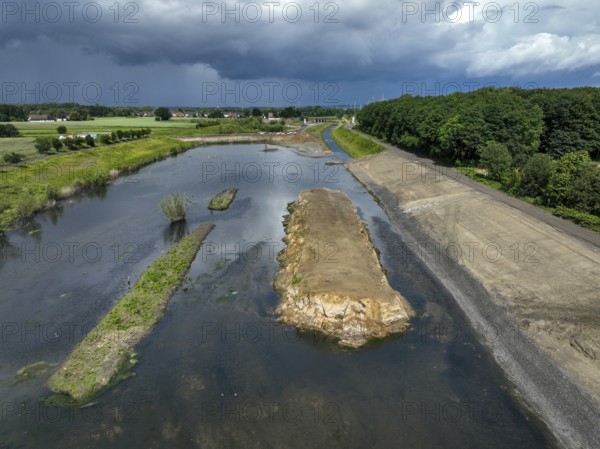 Dortmund / Castrop-Rauxel, North Rhine-Westphalia, Germany, river renaturalisation, renaturation of the Emscher, flood retention basin HRB Mengede. A new floodplain landscape is being created at the Emscher-Auen farm, expanding the area for flood protection during heavy rainfall and for biodiversity. The Emscher, which is currently straightened, will be given curves again and can meander through its new floodplain. Following the construction of a parallel sewer, the Emscher has been completely free of wastewater since 2022. The river was previously an open, above-ground combined sewer with rainwater and wastewater, Europe