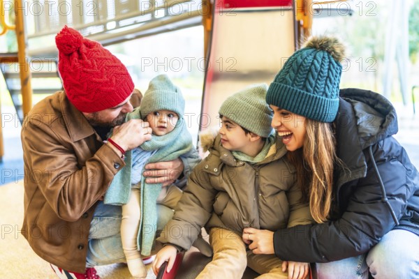 Cheerful parents are enjoying wintertime with their children at an indoor playground, creating a heartwarming scene of family togetherness