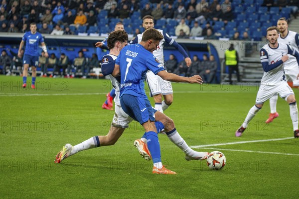 Football UEFA Europa League, 2024/25 season, matchday 7: TSG Hoffenheim v Tottenham Hotspur. Picture: Duel between Tom Bischof (7, Hoffenheim) and Archie Gray (14, Tottenham)