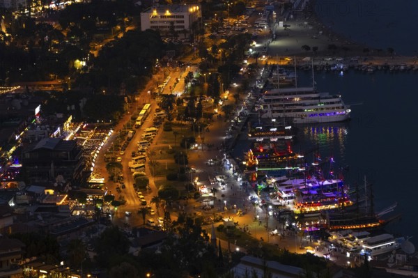 The lights in the harbour of Alanya Turkey shine in the evening, Alanya, Antalya, Turkey, Asia