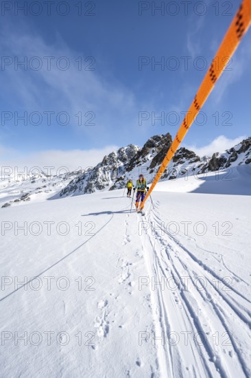 Ski tourer with rope, rope team on the Vadret da Porchabella glacier on the ascent to the summit of Piz Kesch, mountain landscape in winter, alpine tour, ski tour Bündner Haute Route, Albula Alps, Rhaetian Alps, Grisons, Eastern Switzerland, Switzerland, Europe