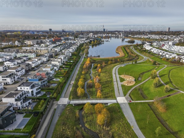 Dortmund, North Rhine-Westphalia, Germany, Phoenix Lake, front of the renaturalised Emscher. The river has been transformed into a near-natural body of water, flood protection and biodiversity through newly designed floodplains. A former industrial wasteland of 99 hectares was transformed into residential, work and leisure areas and 24 hectares of lake surface. In the event of heavy rainfall, the lake acts as a rainwater retention basin. Following the construction of a parallel sewer, the Emscher is now free of wastewater, having previously been an open, above-ground wastewater sewer, combined sewer with surface water and wastewater. The Phoenix Lake, a showcase project for structural change, is an artificial lake on the site of the former Phönix Ost steelworks in Dortmund's Hörde district, Europe