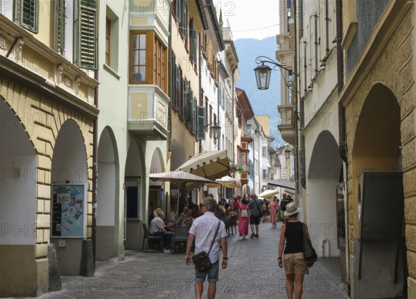 Merano, South Tyrol, Italy, passers-by stroll through the Laubengasse, the arcades are the heart of the old town centre, Europe