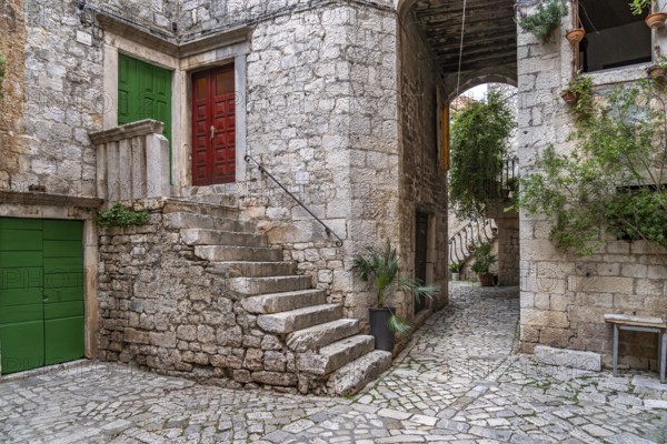 Narrow alley in the old town centre of Trogir, Croatia, Europe