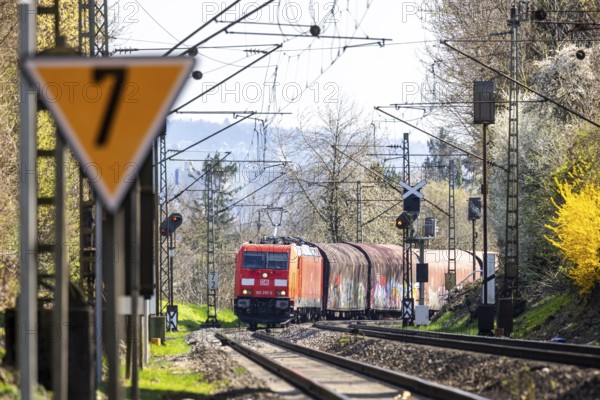Goods train with a Deutsche Bahn AG locomotive travelling on the open track. Stuttgart, Baden-Württemberg, Germany, Europe