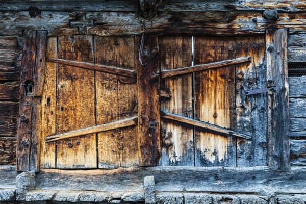 Weathered loading door of an old hay barn, Grimentz, Val d'Anniviers, Valais Alps, Canton Valais, Switzerland, Europe