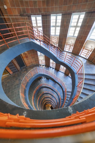Wide-angle shot of a spiral staircase with red banisters, SPRINKENHOF, Hamburg, Germany, Europe