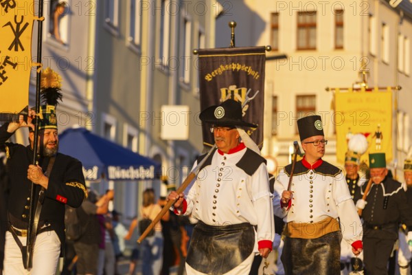 The so-called Bergstreittag is a beautiful centuries-old tradition and is celebrated on 22 July, the church memorial day and former feast day of Mary Magdalene in Schneeberg. The four quarterly sermons introduced in 1649 remained in place until 1845. These sermons were then abolished in favour of a single day, 22 July, which fell on Mary Magdalene. The Freiberg Mining Office recommended that this day should be celebrated with a festival and a mountain parade. In 1846, the Royal Ministry of Finance issued a decree to celebrate St Mary Magdalene's Day with a sermon and a magnificent mountain procession. The last major procession took place in July 1913. The First World War put an end to these processions. The tradition was not revived until July 1933, 528th Bergstreittag, mountain parade, Schneeberg, Saxony, Germany, Europe
