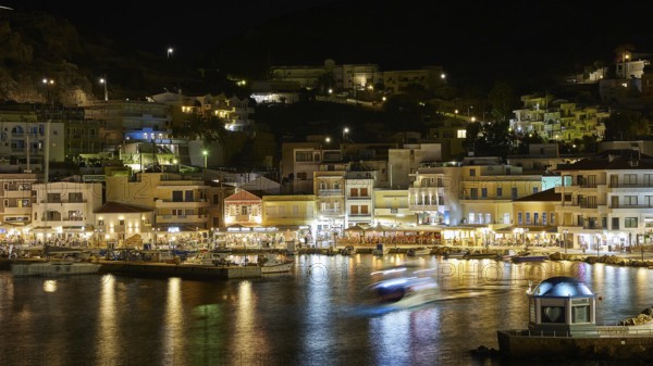 Night shot of a harbour with illuminated buildings and reflecting lights in the water, Pigadia, town and harbour, Pigadia Bay, main town, Karpathos, Dodecanese, Greek Islands, Greece, Europe