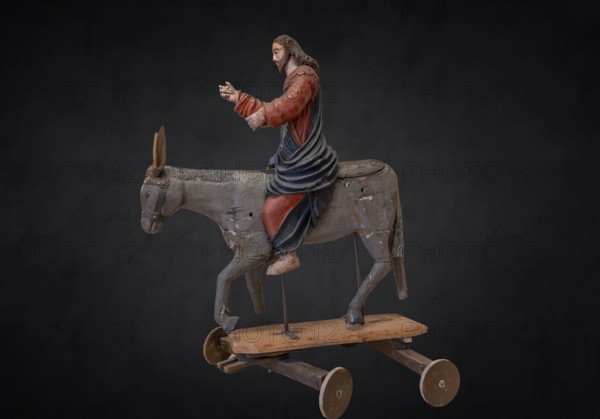 Christ on the palm donkey, on a dark background, wooden figure from around 1400, Museum Bezau, Vorarlberg, Austria, Europe