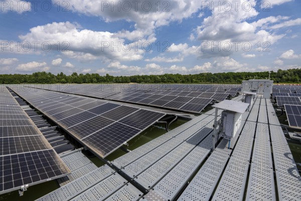 Germany's largest floating solar power plant on the Silbersee III, a quarry pond no longer used for sand mining, near Haltern am See, operated by Quarzwerke GmbH, around 5800 solar modules, on an area of a good 2 football pitches, generate 3.1 megawatts of power, the company uses the electricity itself on weekdays, at weekends it flows into the public grid, North Rhine-Westphalia, Germany, Europe