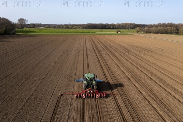 Sugar beet being sown in spring, precision sowing with precision seed drill, behind a tractor, Niederkrüchten, North Rhine-Westphalia, Germany, Europe