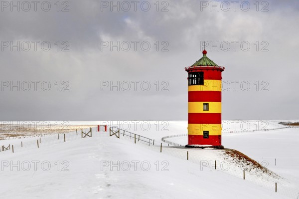 Lighthouse of Pilsum in winter, East Frisia, Lower Saxony, Federal Republic of Germany architecture winter snow dike