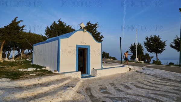 Profitis Ilias Chapel, White and blue chapel in Greece, surrounded by trees on a sunny day, Anthony Quinn Bay, Vagies Bay, Rhodes, Dodecanese, Greek Islands, Greece, Europe