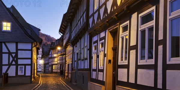 Narrow alley with half-timbered houses and cobblestones in the old town centre in the evening, UNESCO World Heritage Site, Goslar, Lower Saxony, Germany, Europe