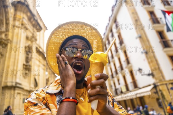 Close-up low angle view portrait of a brunette surprised tourist eating an ice cream in the city