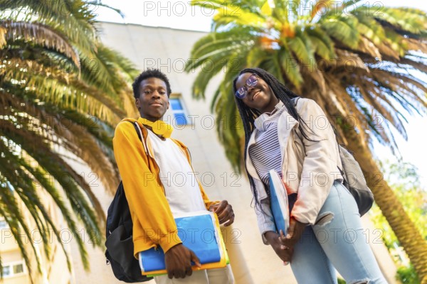 African american university students standing proud smiling at camera in the campus