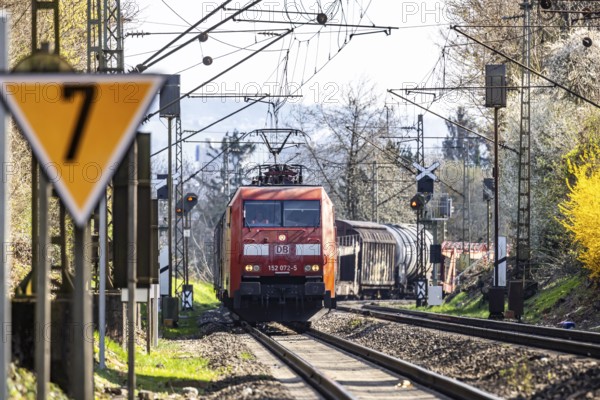 Goods train with a Deutsche Bahn AG locomotive travelling on the open track. Stuttgart, Baden-Württemberg, Germany, Europe
