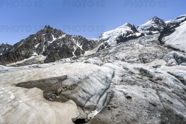 High alpine glaciated mountain landscape, La Jonction, Glacier des Bossons meets Glacier de Taconnaz, summit of Aiguille du Midi, Mont Maudit and Mont Blanc, Chamonix, Haute-Savoie, France, Europe