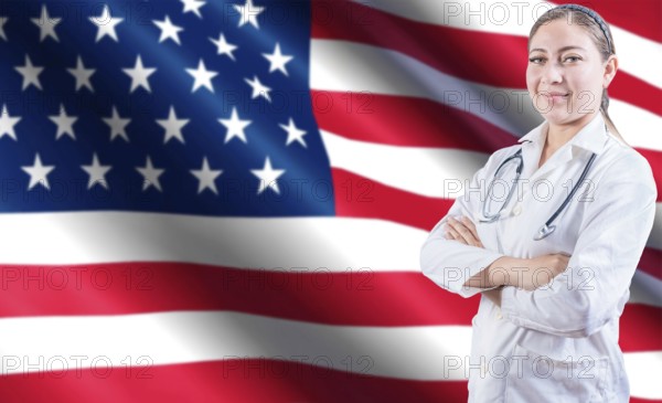 Portrait of female doctor with crossed arms with USA flag in the background. Health and care with flag of United State