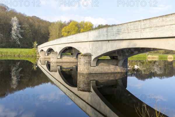 Arched bridge over the Freiberger Mulde with reflection in the water, Westewitz, district of Central Saxony, Germany, Europe