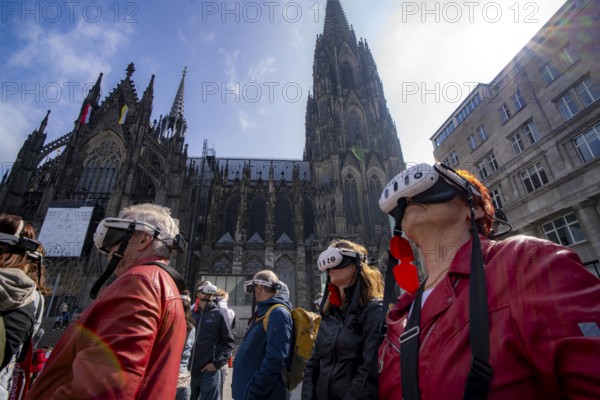 Timeridego, virtual city tour with VR glasses, on various topics, virtual reality time travel into the past of Cologne, here at Cologne Cathedral, North Rhine-Westphalia, Germany, Europe