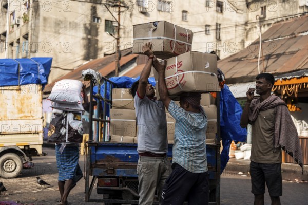 GUWAHATI, INDIA - MAY 1: Labourers carries goods in a wholesale market, in Guwahati, India, on May 1, 2025. May Day or Workers Day is a global holiday celebrated on May 1st to honor workers and their contributions, Asia