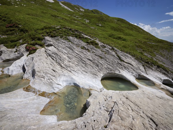 Glacier mill with glacier pots on the Trinser Alp Mora, Trin, Canton Graubünden, Switzerland, Europe