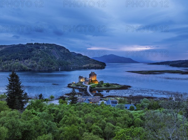 Night over Eilean Donan Castle and Loch Duich from a drone, Isle of Skye, Highlands, Scotland, England, United Kingdom, Europe