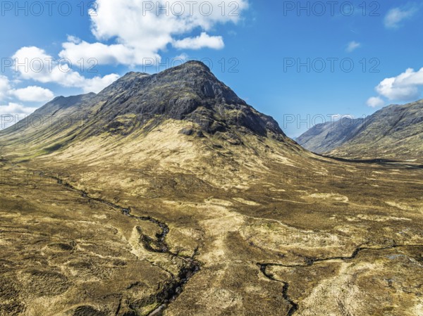 Buachaille Etive Beag and Three Sisters in Glencoe over Moors and Road A82 from a drone, Highlands, Scotland, United Kingdom, Europe