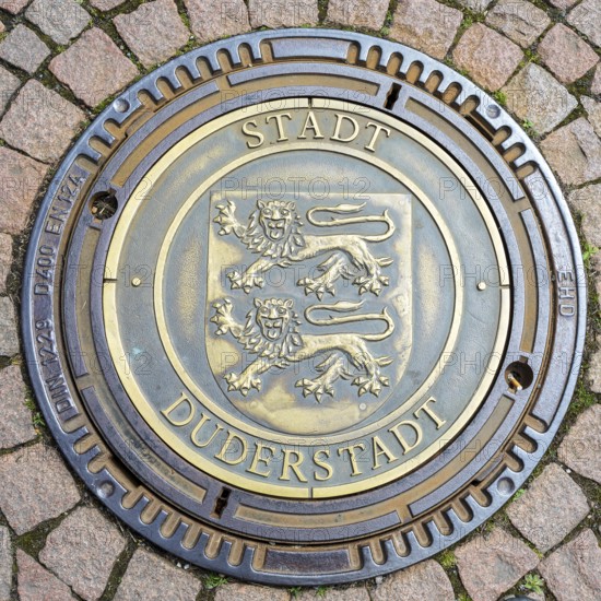 Manhole cover with coat of arms and inscription City of Duderstadt, Lower Saxony, Germany, Europe
