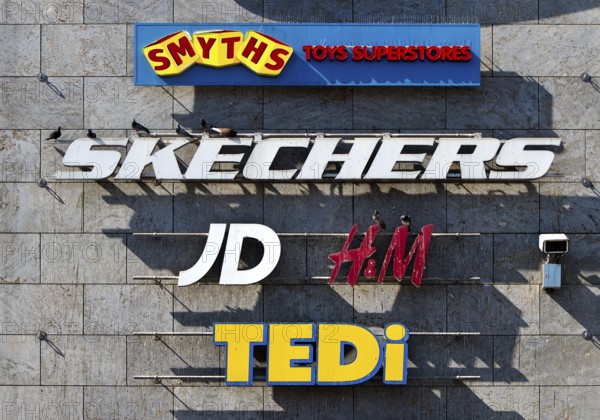 Façade of Forum Hanau with company logos at the shopping centre, Freiheitsplatz, Hanau, Hesse, Germany, Europe