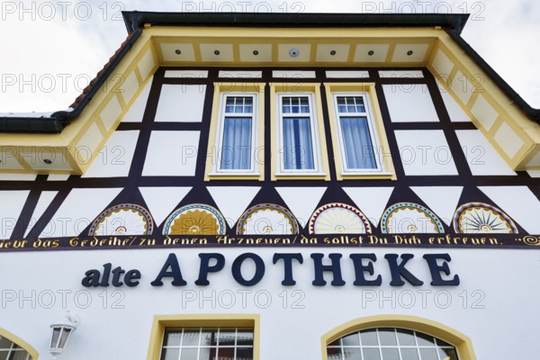 Old pharmacy, facade detail, historic headquarters of the Schierker Feuerstein brand in Schierke, Wernigerode, Harz National Park, Saxony-Anhalt, Germany, Europe