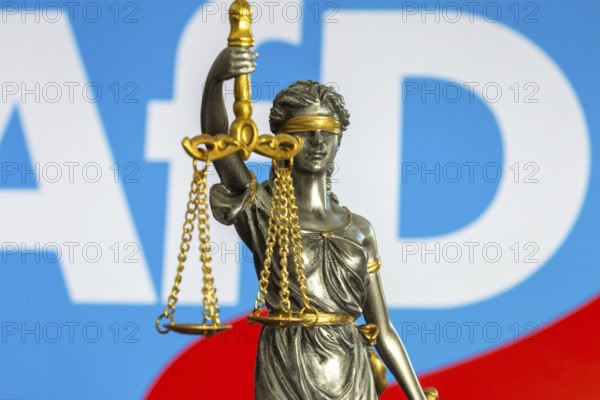 Justitia in front of the AfD logo (symbolic image) . The Office for the Protection of the Constitution has categorised the AfD as right-wing extremist. The AfD wants to take legal action against this