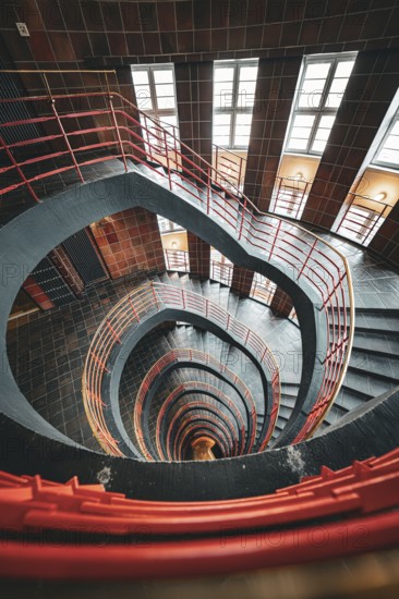 Dramatic spiral staircase with red banisters and windows, SPRINKENHOF, Hamburg, Germany, Europe