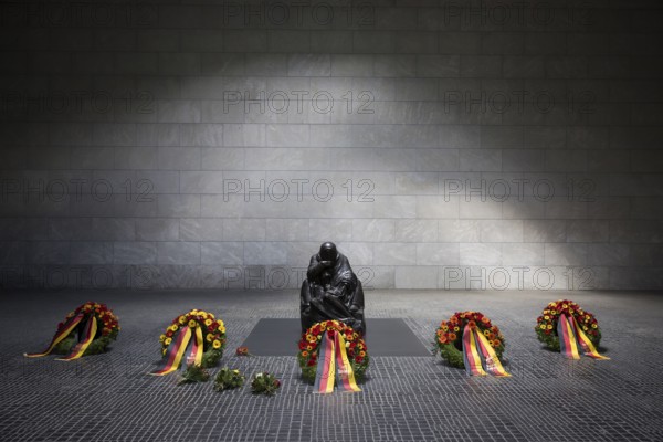 The wreaths of all five permanent constitutional bodies lie in front of the sculpture Mother with dead son by Käthe Kollwitz after the silent commemoration of the 80th anniversary of the end of the Second World War in the Neue Wache, the central memorial of the Federal Republic of Germany for the victims of war and tyranny, Berlin, 8 May 2025