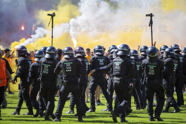 Football 3rd division, 2024/25 season, matchday 37: Waldhof Mannheim v Dynamo Dresden***Pure enthusiasm and a stampede by Dresden fans after the final whistle and promotion to the 2nd division. The police push the fans back