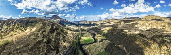 Panorama of Farms and Mountains over River Dochart and Road A85 from a drone, Perthshire, Scotland, UK