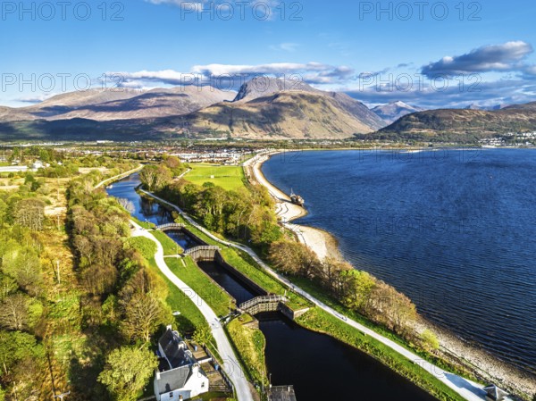 View of Caledonian Canal, Caol Beach and Nevis Range Mountains from a drone, Corpach, Fort William, Highland, Scotland, United Kingdom, Europe