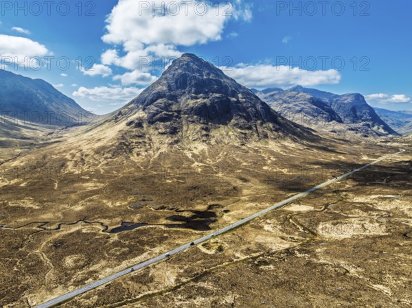 Buachaille Etive Beag and Three Sisters in Glencoe over Moors and Road A82 from a drone, Highlands, Scotland, United Kingdom, Europe